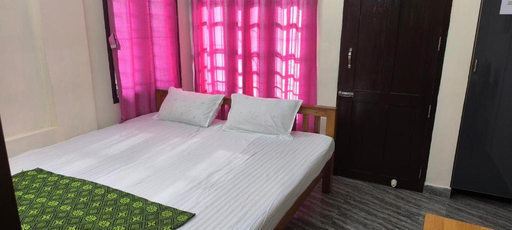 Ένα ή περισσότερα κρεβάτια σε δωμάτιο στο Hornbill inn