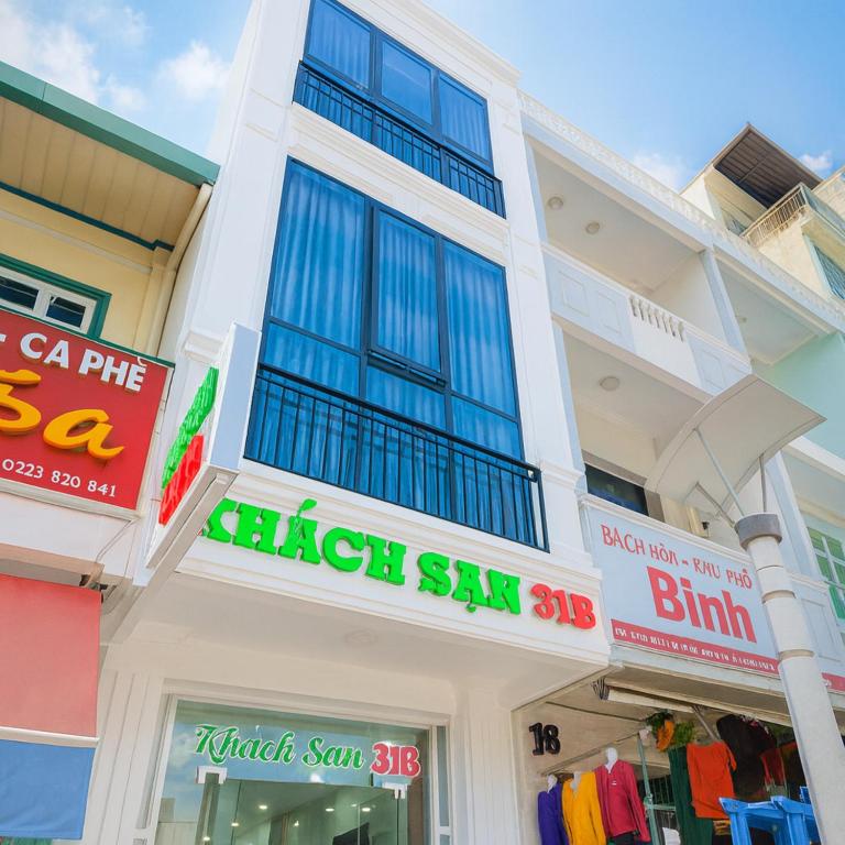 a store with signs on the front of a building at 31B Hotel - Near Ninh Kieu Wharf in Can Tho
