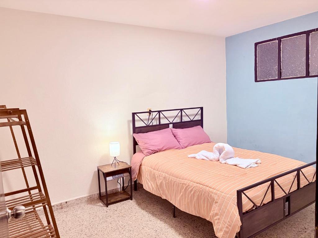 Postel nebo postele na pokoji v ubytování La casa de los abuelitos, lugar acogedor y mágico