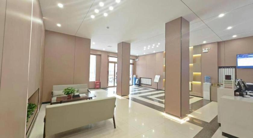 an office lobby with a reception desk and a tv at PAI Hotel Huayin Huashan Mountain Scenic Spot Ancient Street in Huayin
