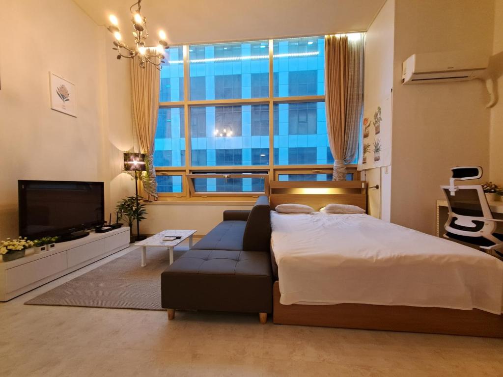 En eller flere senge i et værelse på Laflee stay #Gangnam #Coex