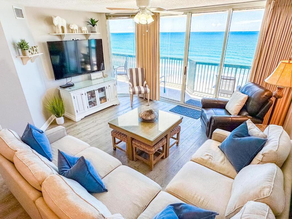 a living room with a couch and a table at Ashworth 905 in North Myrtle Beach
