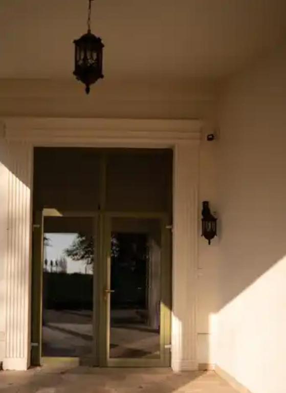 an entrance to a building with a glass door at John Bull House in Buzău
