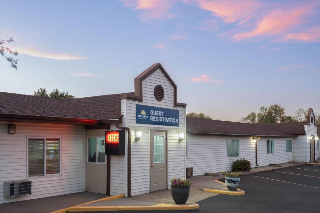 a building with a sign that reads cash reception at Days Inn by Wyndham Jamestown in Jamestown