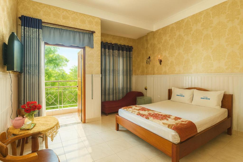 Giường trong phòng chung tại Thuận Phát Motel Bình Dương