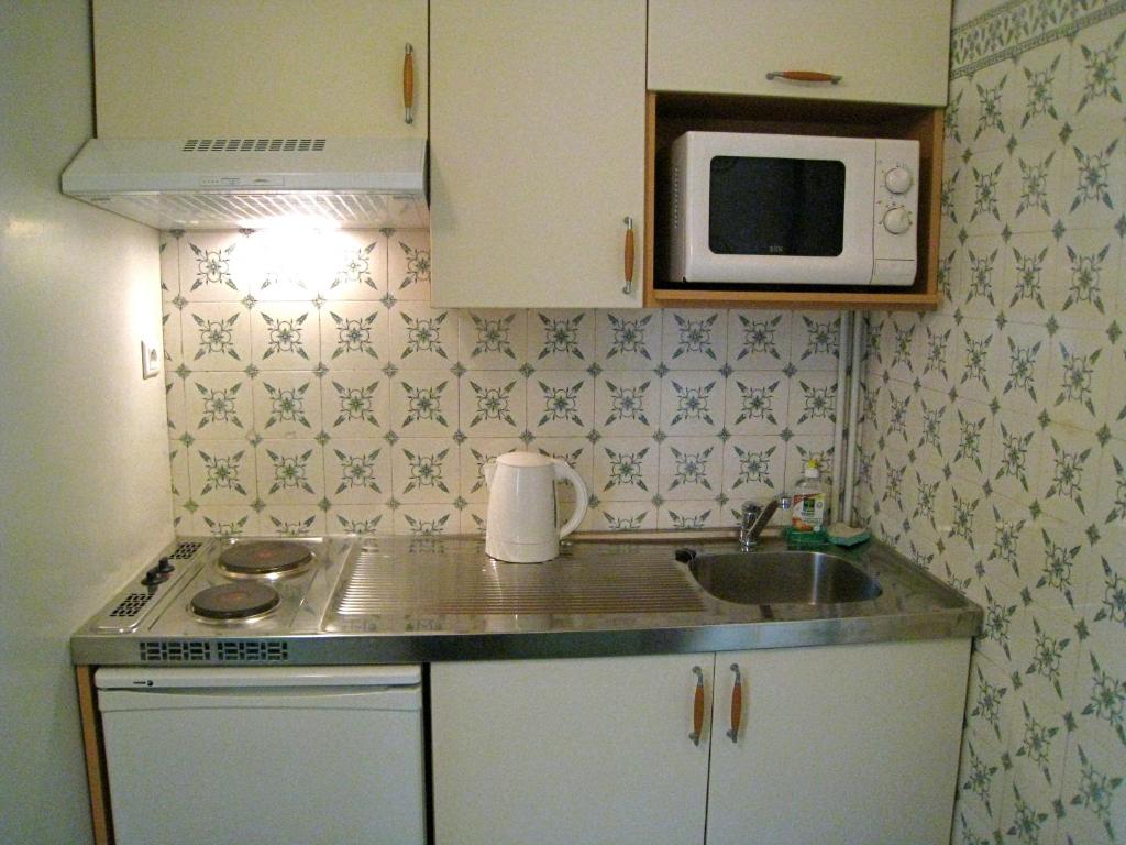 Kuchyň nebo kuchyňský kout v ubytování Résidence La Villa Léonie