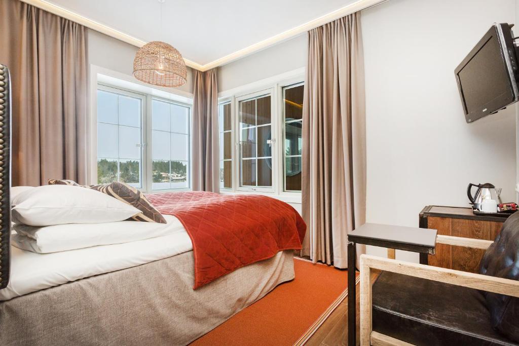 Ένα ή περισσότερα κρεβάτια σε δωμάτιο στο Dyreparken Safarihotell