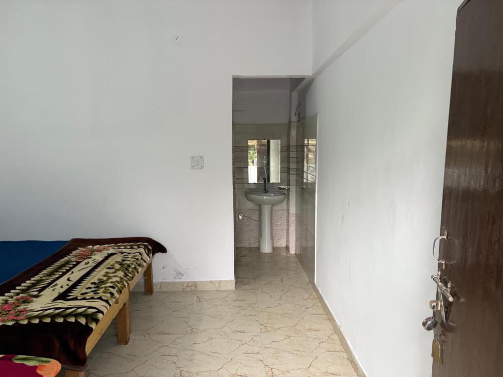 Ένα ή περισσότερα κρεβάτια σε δωμάτιο στο Khati's hotel