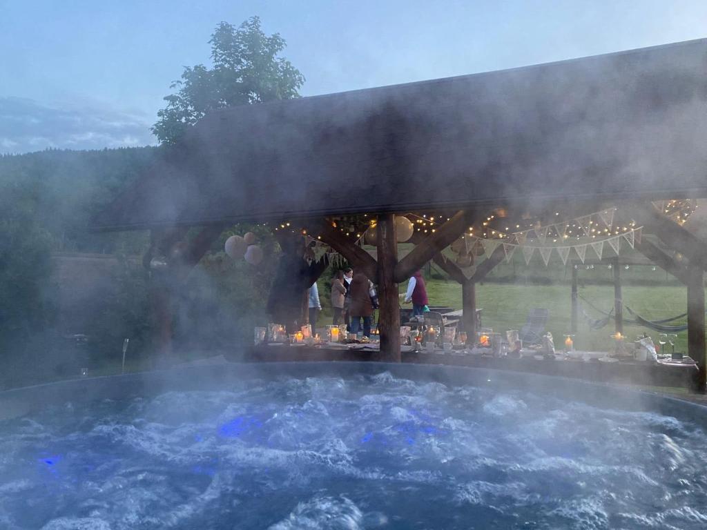 a hot tub with smoke coming out of it at U Eli I Tomka in Krzyżowa