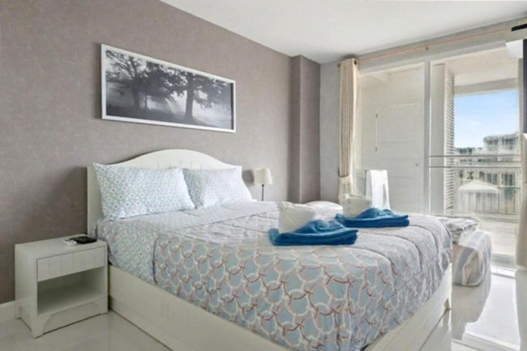 Ένα ή περισσότερα κρεβάτια σε δωμάτιο στο The Energy Hua Hin - 1 bedroom Condo with Seaview