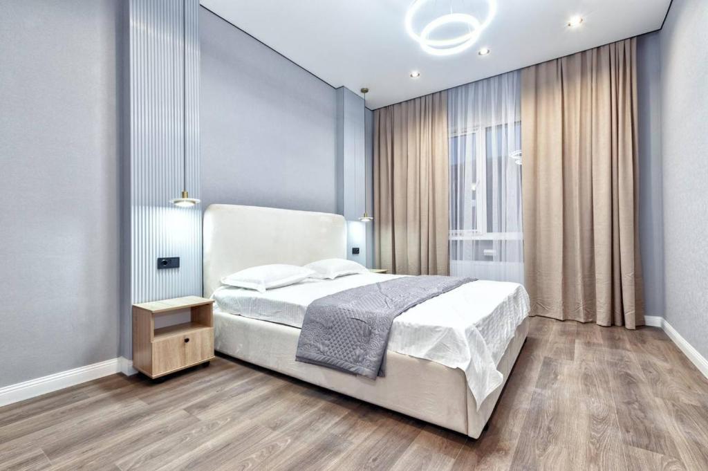 Postel nebo postele na pokoji v ubytování Millennium Park, жилой комплекс