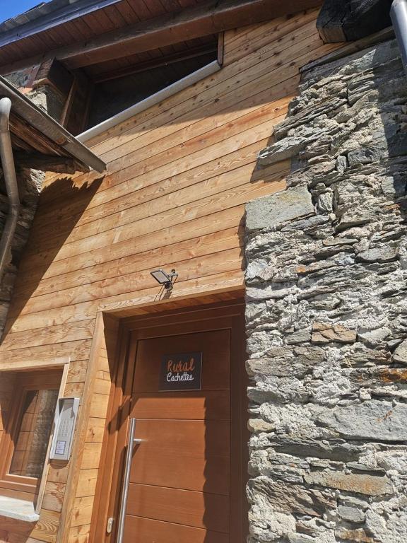 a building with a door with a sign above it at Rural Cachettes in La Salle