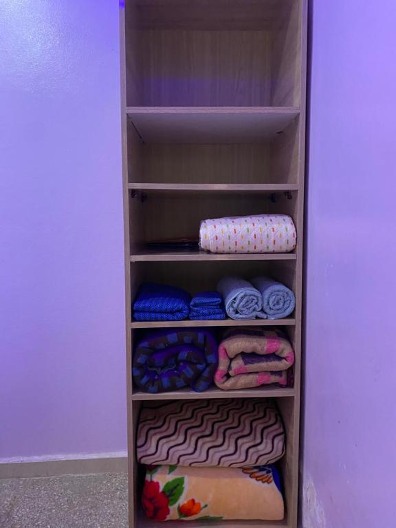 a refrigerator filled with lots of clothes and towels at Appartement au centre de TIZNIT in Tiznit