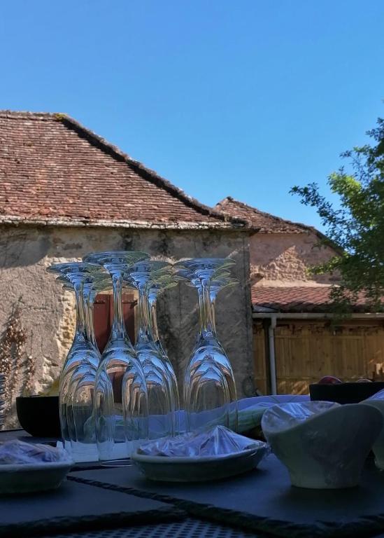 a group of clear glasses sitting on a table at A Pers in Saint-Projet