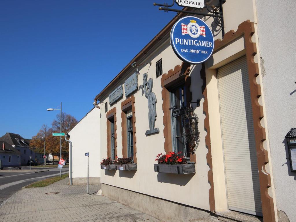 a building with a sign on the side of it at Holiday Home Friedl by Interhome in Ritzing