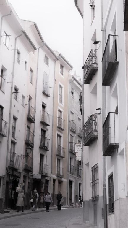 a group of people standing in front of buildings at Alfonso VIII 20 in Cuenca