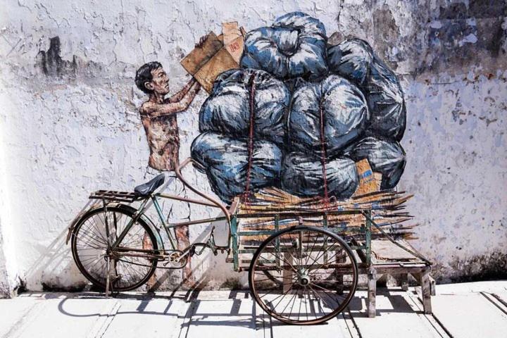 a painting of a man pushing a cart filled with bags at IPOH Rainbow Blissful Villa, Persiaran Halaman Ampang Ipoh in Ipoh