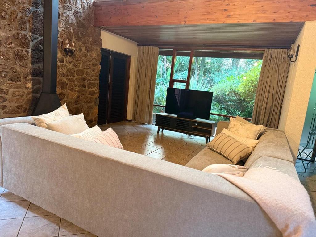 TV a/nebo společenská místnost v ubytování Jardin Villa