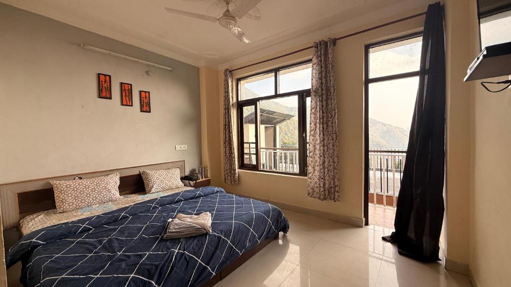 Ένα ή περισσότερα κρεβάτια σε δωμάτιο στο Ghar by the mountains