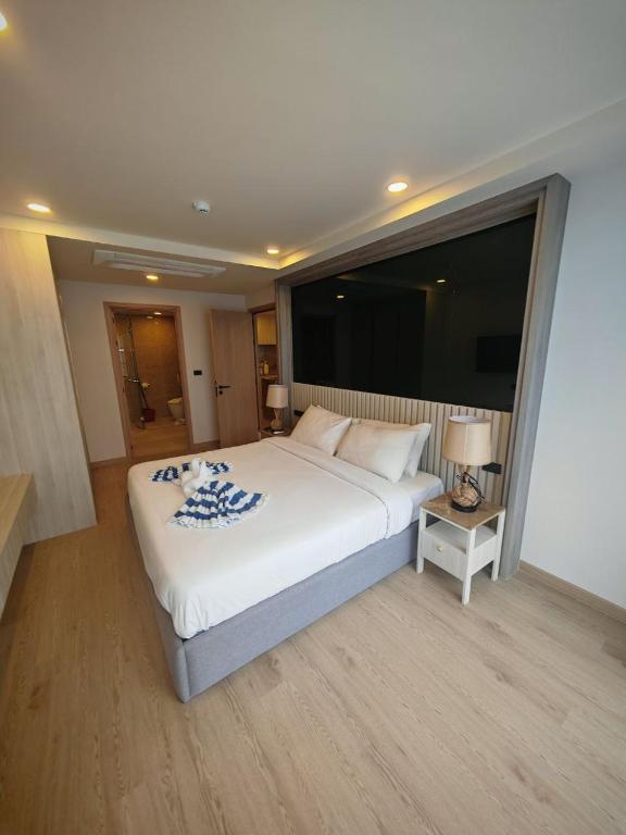 Voodi või voodid majutusasutuse Phuket Family apartment toas