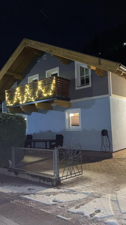 a house with a deck with lights on it at Ferienwohnung Maier in Mittersill