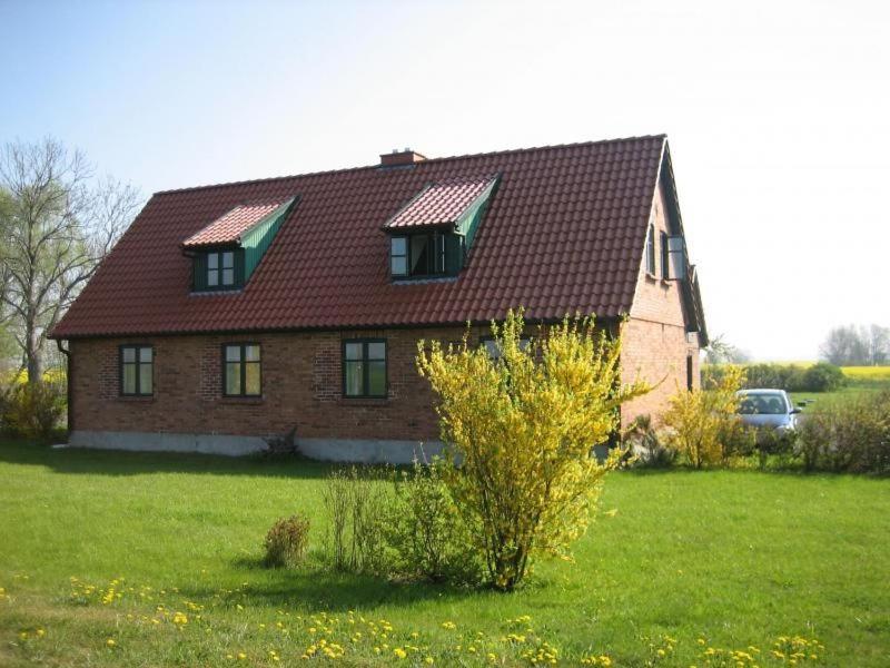 a house with two windows and a roof at Ferienwohnung Möwe In Ummanz Lüßvitz in Ummanz