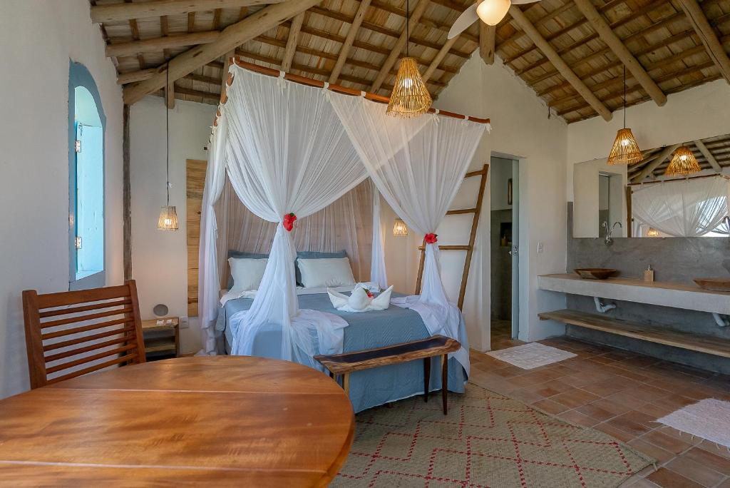 En eller flere senge i et værelse på Nuhatê Casa Hotel