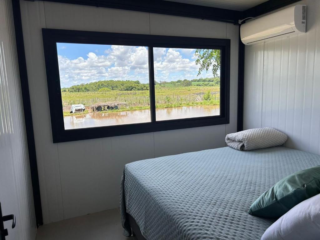 En eller flere senge i et værelse på Modulo do Plátanos