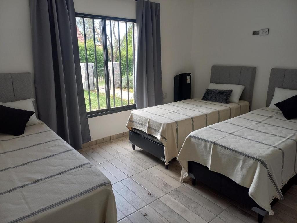 Postel nebo postele na pokoji v ubytování La Casa del Mirador