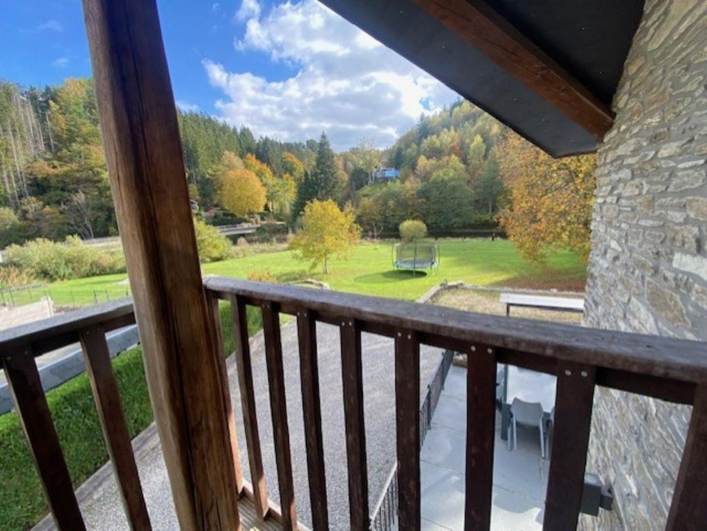 a balcony with a view of a park at Maboge 20C in La Roche-en-Ardenne