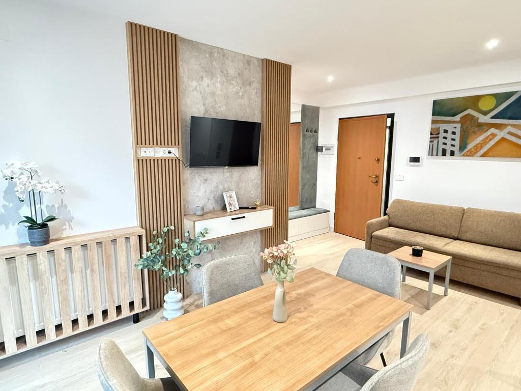 TV a/nebo společenská místnost v ubytování Vuya LOFT Aparthotel by Cozy Apartments