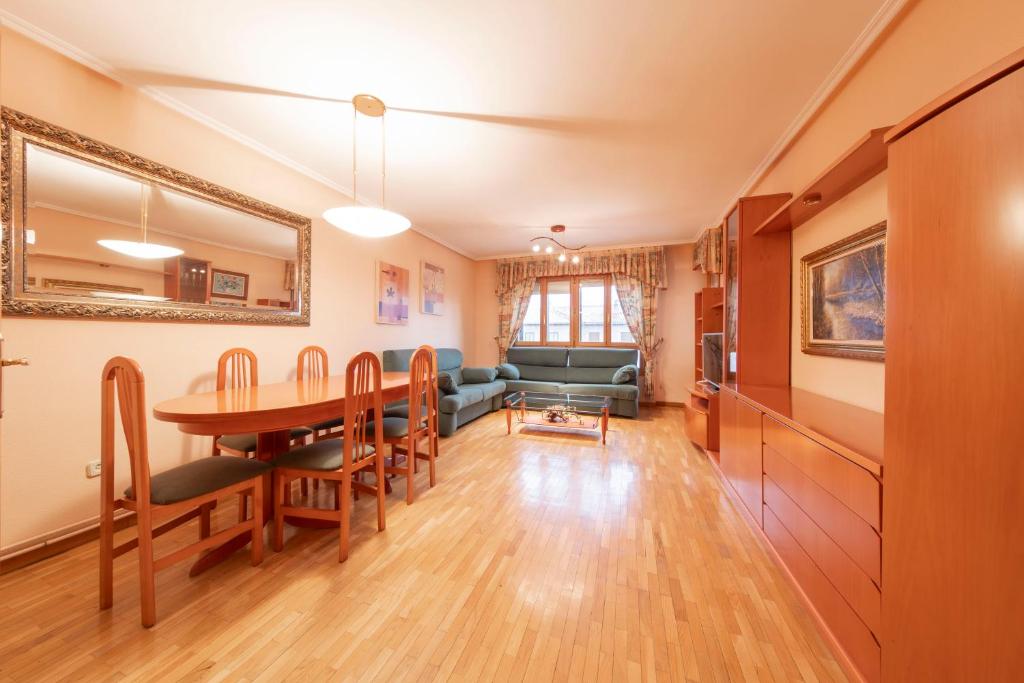 a living room with a table and a dining room at Historic Village Escape in Burgo de Osma in El Burgo de Osma