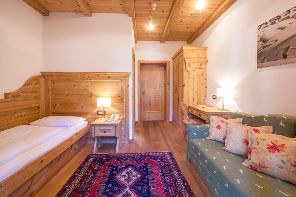 Postel nebo postele na pokoji v ubytování Hotel Corona Krone