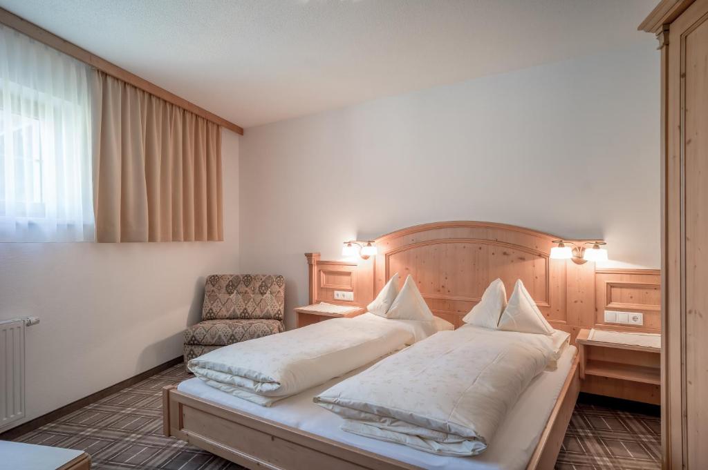Кровать или кровати в номере Alpenresidenz am Mühlbach