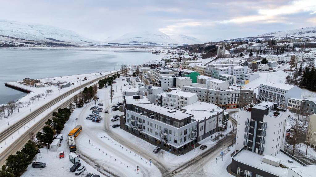 an aerial view of a city with snow covered buildings at New Downtown Retreat in Akureyri