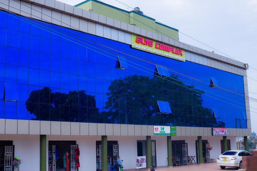 Un edificio con un cartel al costado. en BH Buziga, en Kampala