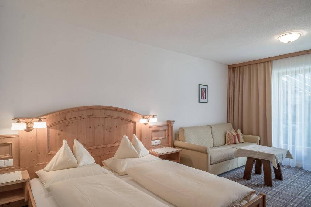 Кровать или кровати в номере Alpenresidenz am Mühlbach