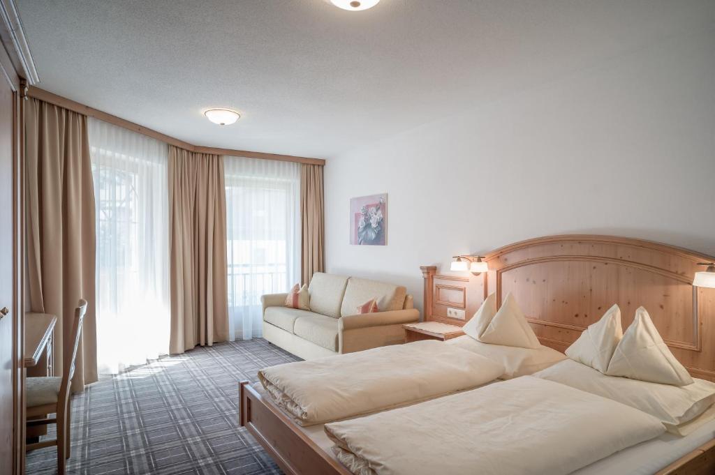 Кровать или кровати в номере Alpenresidenz am Mühlbach