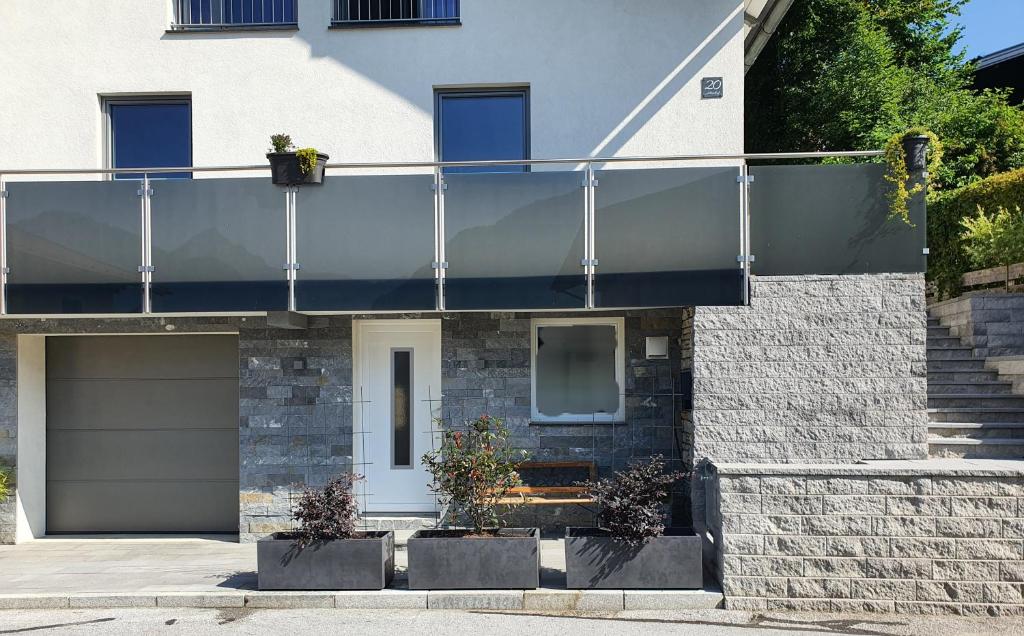 a house with a balcony on top of it at Apartment Altenhof in Altenhof