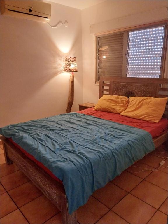 Una cama o camas en una habitación de Les Myriades