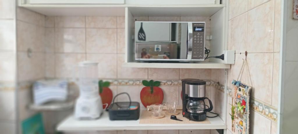 Кухня или мини-кухня в Lindo apto frente mar em região privilegiada de Santos
