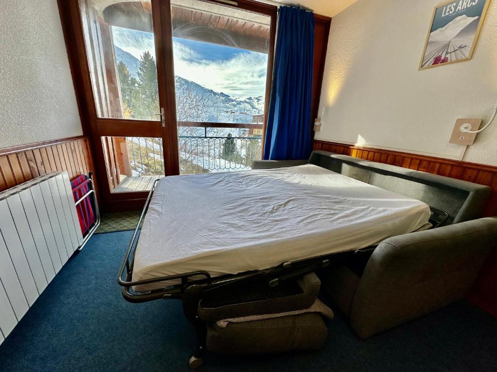 Кровать или кровати в номере L'Etoile d'Arc 2000 - Ménage inclus - Arc 2000 - Ski IN-OUT - La Conciergerie du Varet