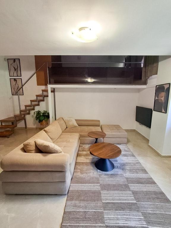 a living room with a couch and a table at City Loft in Sparta
