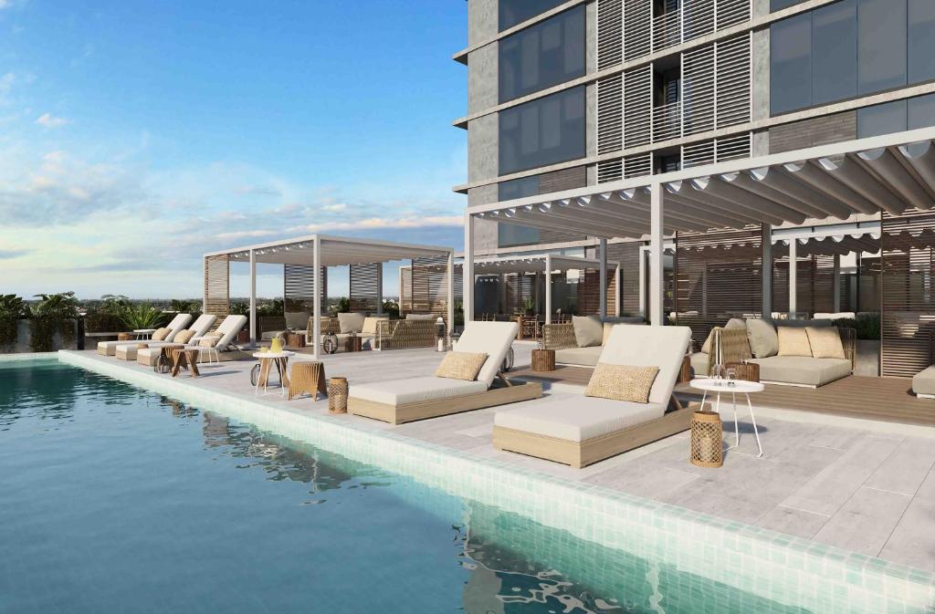 a rendering of a resort with a swimming pool at RentUp Suites Palmas Park Buenavista in Victoria