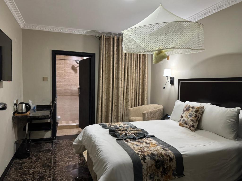 Ένα ή περισσότερα κρεβάτια σε δωμάτιο στο Annavilla7 Lilongwe hotel