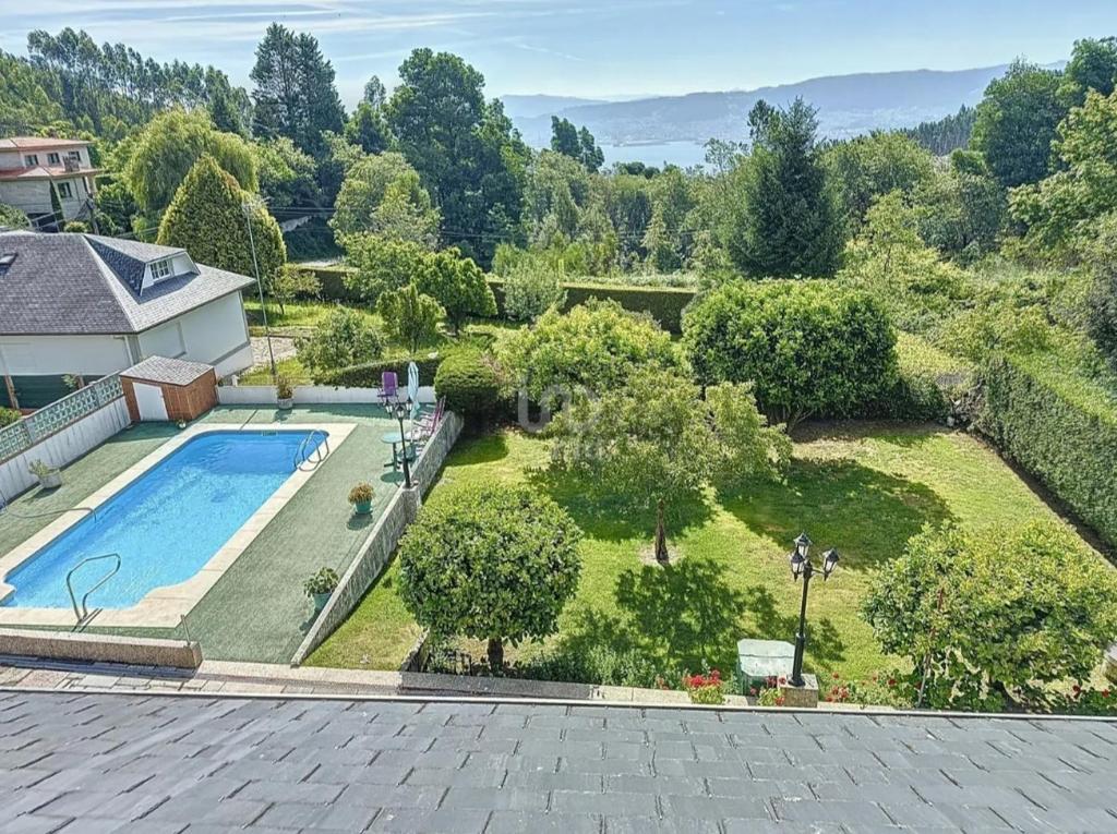 an aerial view of a yard with a swimming pool at El mirador de Monte Bouza in Monte Bouza