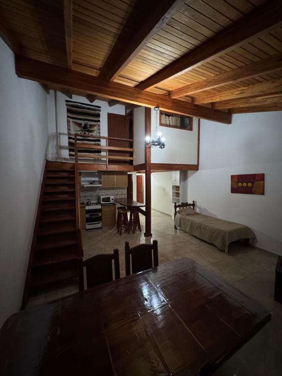 a living room with a table and a couch at Pepina Mina Clavero in Mina Clavero