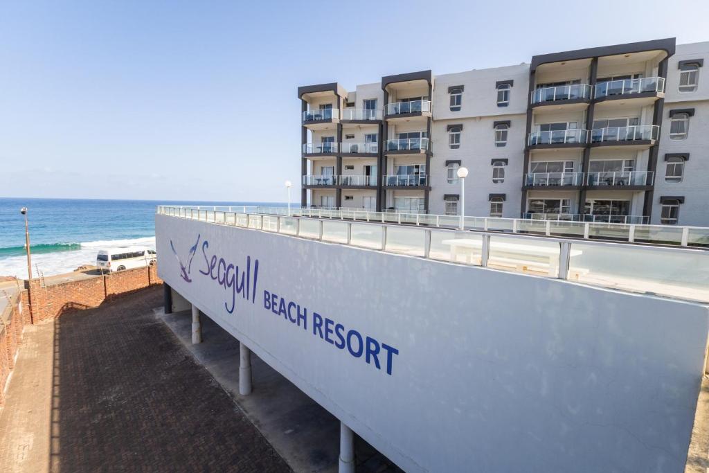 a building on the beach next to the ocean at Seagull Apartment -2 Bedroom Apartment 408 by First Private Stays in Margate
