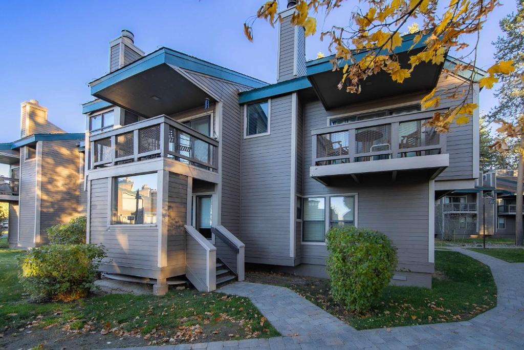 a house with a porch and a balcony at Aspen Edge Lakefront and Loft in South Lake Tahoe