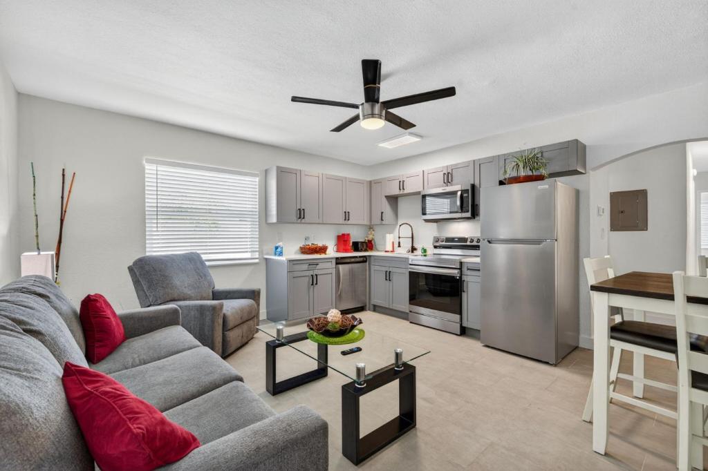 a living room with a couch and a kitchen at Park Shore Suites Unit 6 in St. Pete Beach